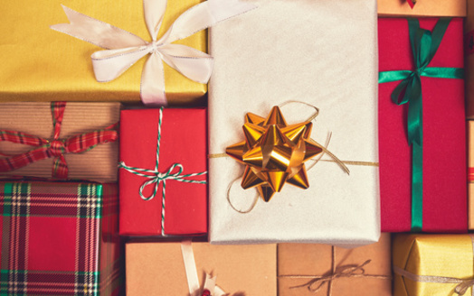 According to the National Retail Federation, American consumers spend an average of $902 on gifts and other holiday items each Christmas. (Adobe Stock)