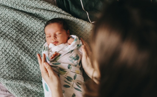 Thirteen states and the District of Columbia have laws providing paid family and medical leave programs for eligible workers, according to federal data. (Adobe Stock)<br />