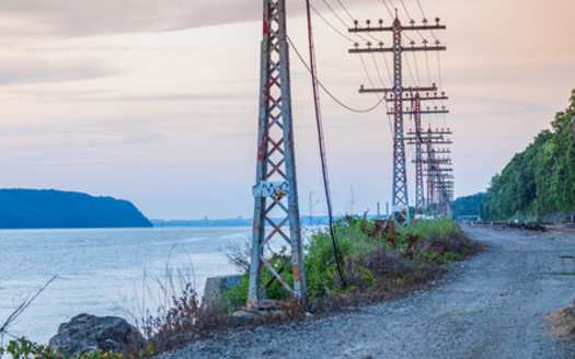 Despite the New York Climate Leadership and Community Protection Act's minimum benefits for disadvantaged communities, there is insufficient integration of this and other justice mandates of the law into energy transmission plans. (Adobe Stock)