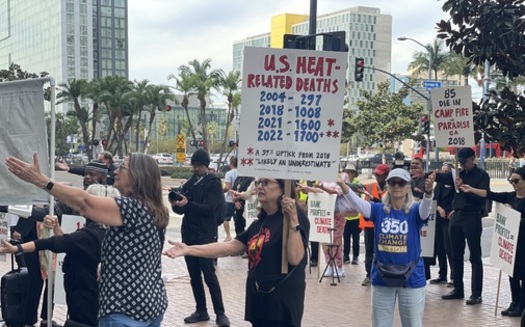 Protesters with the Interfaith Coalition for Earth Justice of San Diego drew attention to the effects of climate change at an event in November. (GreenFaith)<br />