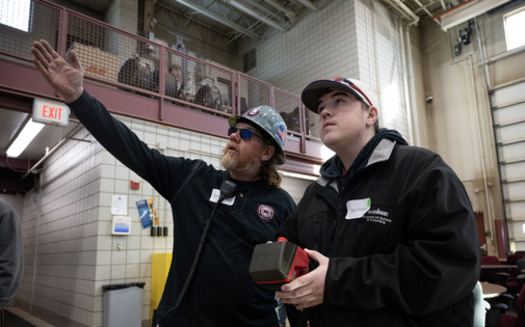 A Minnesota high school student gets an in-person learning experience about aspects of construction work after taking an online elective course now being offered. (Photo courtesy Fair Contracting Foundation of Minnesota)
