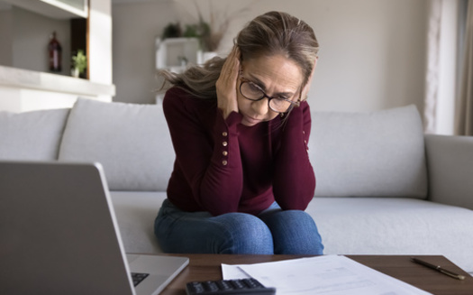 More than one in three older Americans who still owe debt from college live with a child or parent, according to New America. (Adobe Stock)