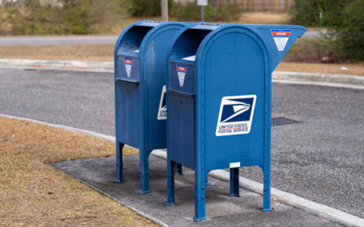 Lawmakers remain divided on how to address the U.S. Postal Service's financial crisis, with some advocating for government aid and others pushing for structural reforms. (Red Lemon/Adobe Stock)