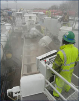 PHOTO: Silica dust by worker conducting sand transfer operations. Photo credit: NIOSH 