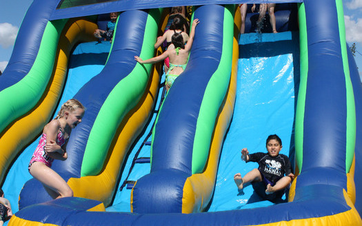 PHOTO: Kids on a water slide. Photo Credit: Deborah Smith