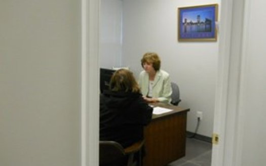 PHOTO: Maryland Legal Aid paralegal meeting with a Pro Bono Day visitor