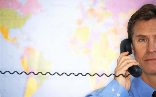 PHOTO: Man with map and telephone. 