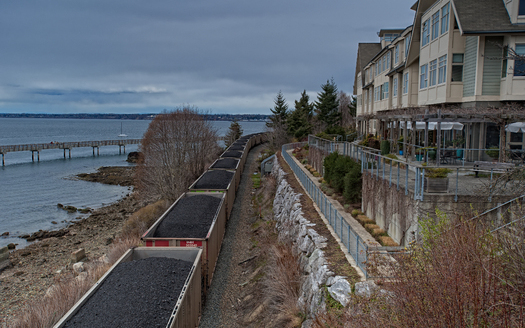 PHOTO: A train loaded with coal on the Bellingham tracks, near homes and Boulevard Park. Photo credit: Paul K. Anderson
