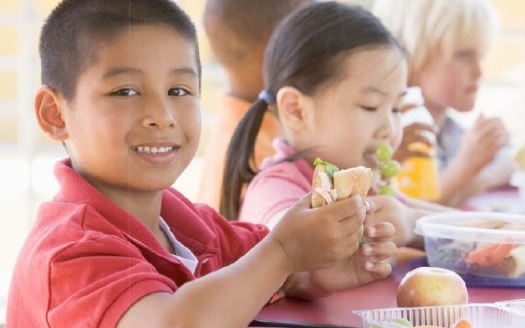 Photo: children eating at school program   Courtesy of frac.org