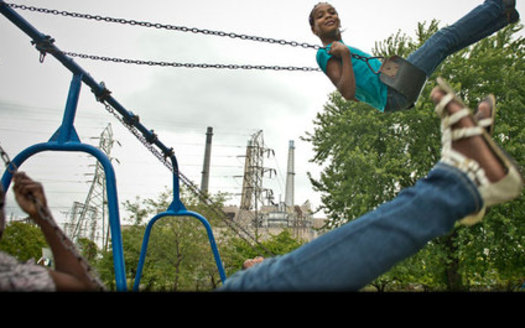 PHOTO: A Child in Belinger Park, located between the River Rouge plant and steel mill. Credit: Ami Vitale/Panos Pictures