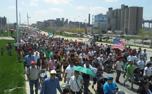 PHOTO: Much of the debate about immigration reform centers on its impact on working conditions and the job market. Photo of a pro-reform rally courtesy of Interfaith Worker Justice.