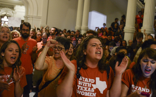 PHOTO: Opponents rallied at the State Capitol as abortion restrictions were turned back, only to be brought back to the forefront when Gov. Perry immediately called a second special session. Photo credit: Lauren Gerson.