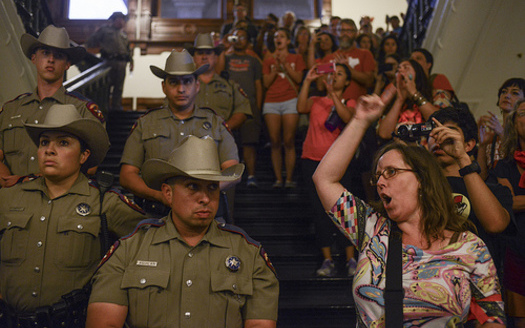 PHOTO: Texas Rangers lined the stairwells and halls of the Capitol rotunda during this month's peaceful protests against HB2. Photo by Lauren Gerson.
