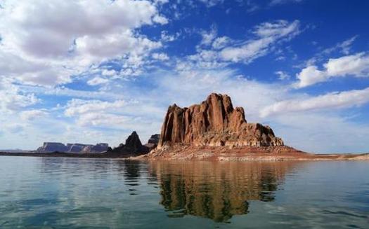 PHOTO: Gregory Butte, as seen from Lake Powell. The lake is as popular as a summer boating destination as it is a water source for the Southwest. Photo credit: Bob Moffitt, National Park Service.