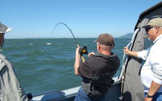 PHOTO: Some Northwest fishermen say the 'thrill of the catch' would be a lot less thrilling if coal shipments compromise air and water quality on the Columbia River. Photo credit: Nic Callero.