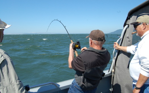 PHOTO: Some Northwest fishermen say the 'thrill of the catch' would be a lot less thrilling if coal shipments compromise air and water quality on the Columbia River. Photo credit: Nic Callero.