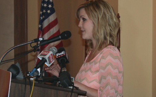 PHOTO: Former CPS caseworker Ashley Kelly tells advocates the child welfare system is so overwhelmed that children would sometimes have to spend the night sleeping in state offices. Photo credit: Doug Ramsey.
