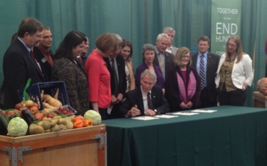 PHOTO: Fresh food and farmers were on hand, along with representatives of the Oregon Food Bank, when Gov. John Kitzhaber signed legislation on Thursday reinstating and increasing the Crop Donation Tax Credit. Photo credit: Kara Walker, Office of Oregon House Republicans.