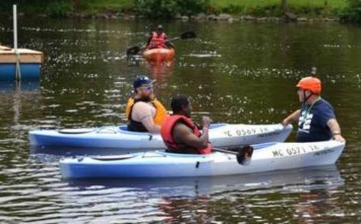 PHOTO: Trip organizer Scott Fraser, right, uses kayaking to help veterans and others living with disabilities or cognitive challenges regain independence and enhance their lives. Photo credit: Highland River Adventures, Vineyard Production.