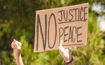 The police killing of George Floyd in Minneapolis in May ignited calls across the globe to re-examine police tactics and the structure of departments. (Adobe Stock)