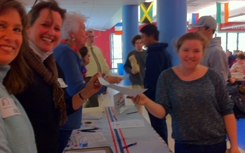 Photo of voter registration drive at Wilton High School. The League of Women voters is using the 93rd birthday of the 19th Amendment to highlight voter outreach. Photo Credit: Young-Kleinfeld