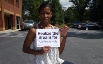 Photo: Etheridge preparing for silent vigil at Guildford College. Courtesy: American Friends Service Committee